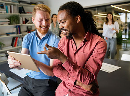 two marketing professionals reviewing 