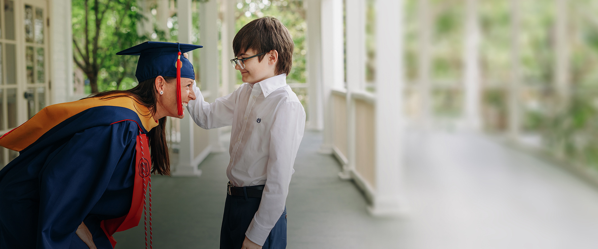 Desoto Admissions team speaking to a future student at an event