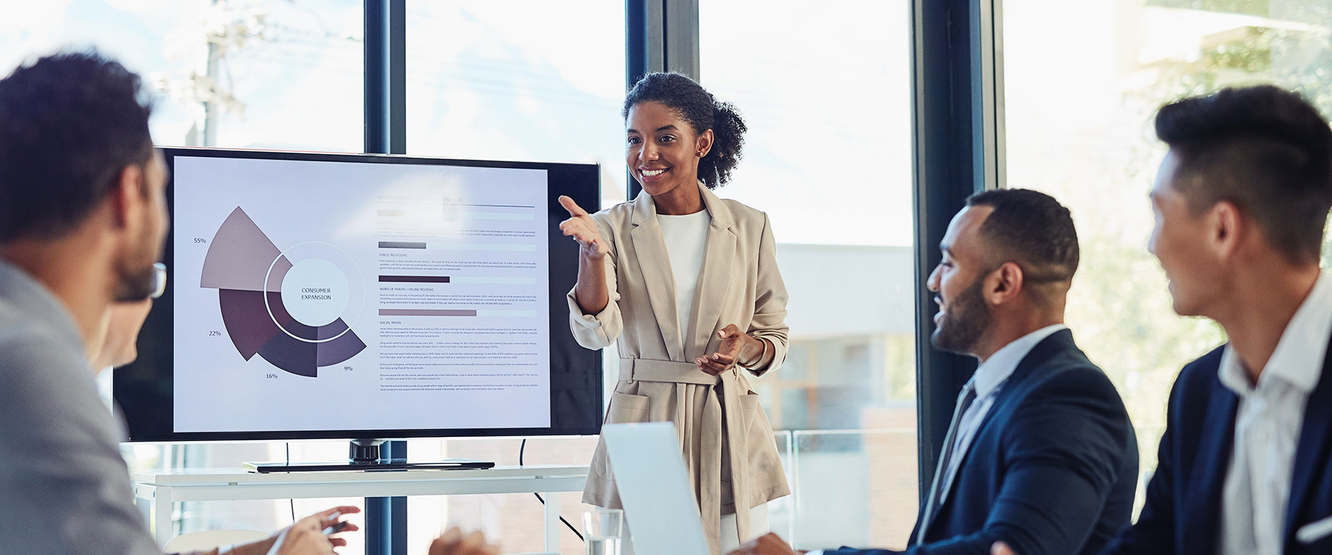 Woman in board room leading a meeting