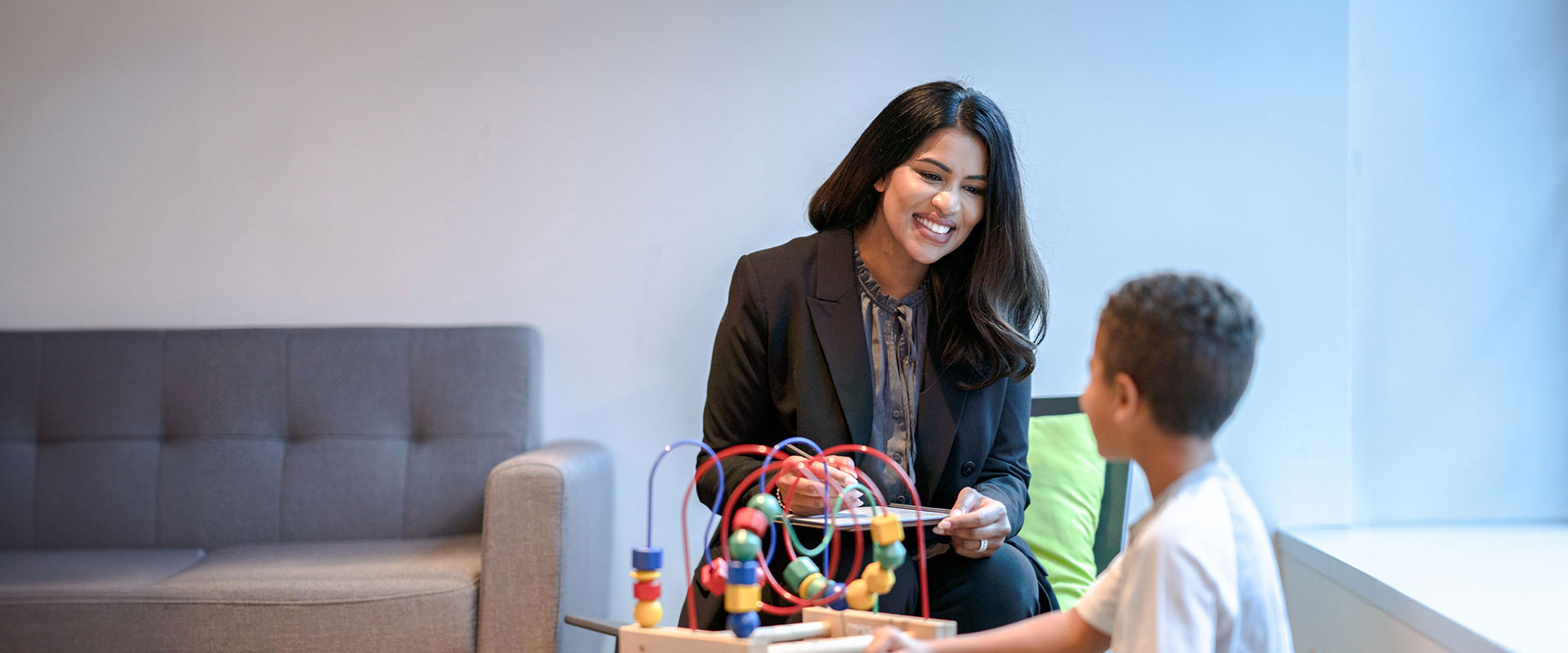 Woman office with child and toys